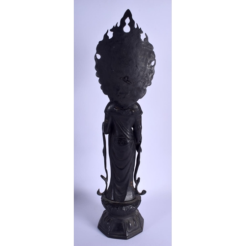 1470 - A VERY LARGE CHINESE IRON FIGURE OF A STANDING BUDDHISTIC DEITY modelled upon a lotus throne. 58 cm ... 