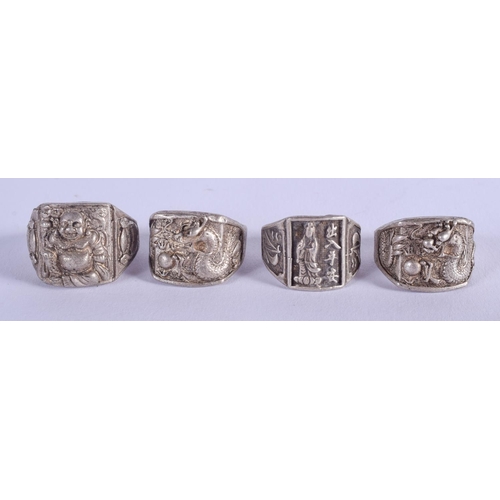 1489 - FOUR CHINESE WHITE METAL RINGS 20th Century. (4)