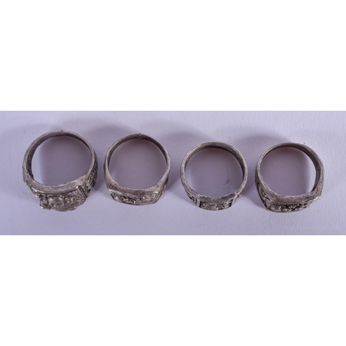 1489 - FOUR CHINESE WHITE METAL RINGS 20th Century. (4)