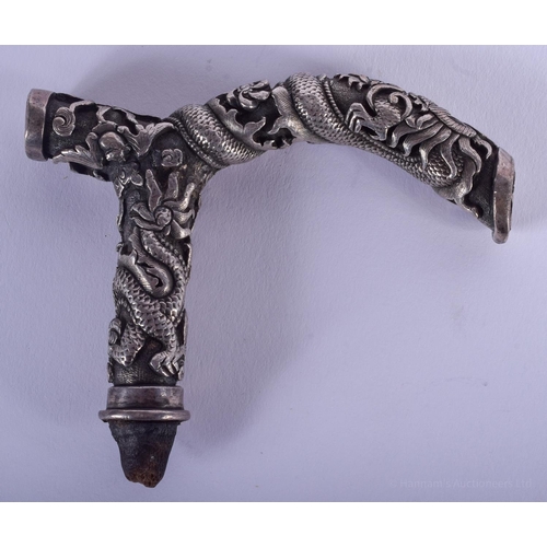 1491 - A 19TH CENTURY CHINESE SILVER DRAGON CANE HANDLE decorated with dragons in various pursuits. 115 gra... 