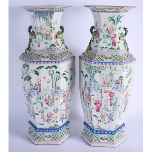 1492 - A LARGE PAIR OF LATE 19TH CENTURY CHINESE TWIN HANDLED FAMILLE ROSE VASES Qing, painted with figures... 