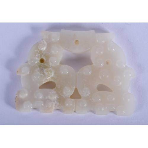 1496 - AN EARLY 20TH CENTURY CHINESE CARVED WHITE JADE ARCHAIC TOOL. 5.5 cm x 4 cm.