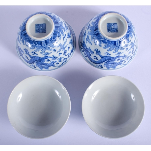 1503 - A PAIR OF CHINESE BLUE AND WHITE PORCELAIN DRAGON BOWLS AND COVERS 20th Century, bearing Qianlong ma... 