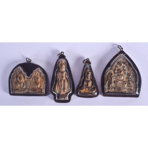 1504 - FOUR EARLY 20TH CENTURY SOUTH EAST ASIAN SILVER MOUNTED BUDDHISTIC ICONS. Largest 6 cm x 6 cm. (4)