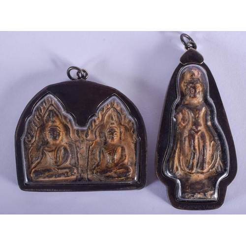 1504 - FOUR EARLY 20TH CENTURY SOUTH EAST ASIAN SILVER MOUNTED BUDDHISTIC ICONS. Largest 6 cm x 6 cm. (4)