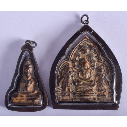 1504 - FOUR EARLY 20TH CENTURY SOUTH EAST ASIAN SILVER MOUNTED BUDDHISTIC ICONS. Largest 6 cm x 6 cm. (4)