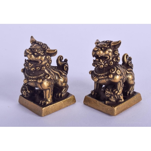 1516 - A PAIR OF CHINESE BRONZE BUDDHISTIC LION SEALS 20th Century. 3 cm x 1.5 cm.