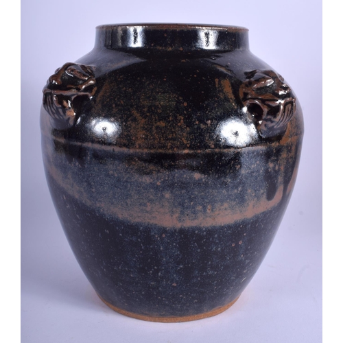 1596 - A CHINESE BROWN GLAZED STONE WARE JAR with mask head mounts. 24 cm x 16 cm.