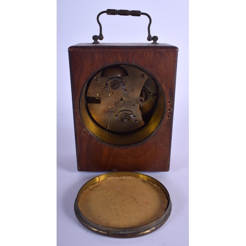 1750 - AN ANTIQUE OAK CASED PIGEON RACING CLOCK. 20 cm high inc handle.