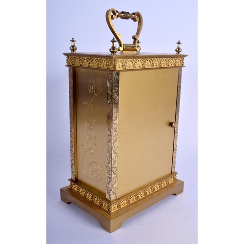 1757 - A BOXED JUNGHANS BRASS MANTEL CLOCK decorated with foliage. 20 cm x 14 cm.