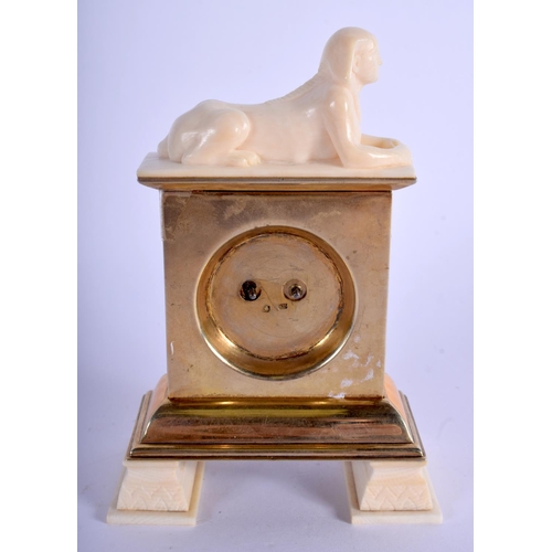 1763 - A 19TH CENTURY FRENCH SILVER GILT AND ENAMEL IVORY DESK CLOCK Egyptian Revival. 12 cm x 7.5 cm.