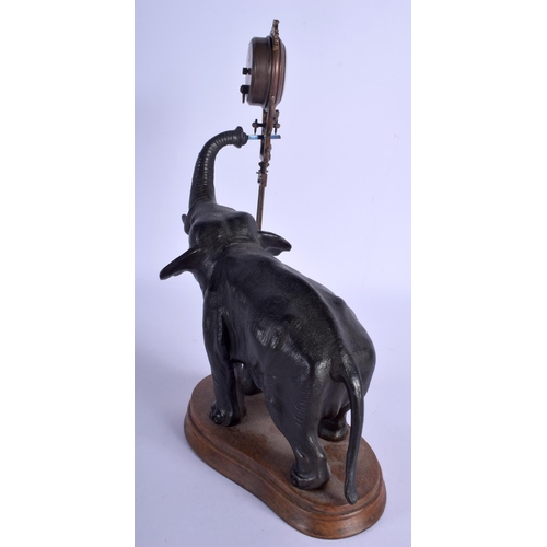 1766 - A RARE ANTIQUE EUROPEAN BRONZE ELEPHANT MYSTERY CLOCK modelled upon an oak plinth. Elephant 21 cm x ... 