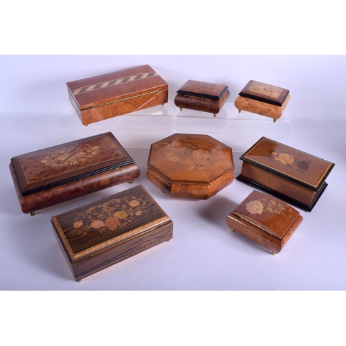 1767 - A GROUP OF EIGHT ITALIAN AND SWISS WALNUT MUSICAL BOXES some combined with jewellery boxes. Largest ... 