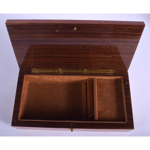 1767 - A GROUP OF EIGHT ITALIAN AND SWISS WALNUT MUSICAL BOXES some combined with jewellery boxes. Largest ... 