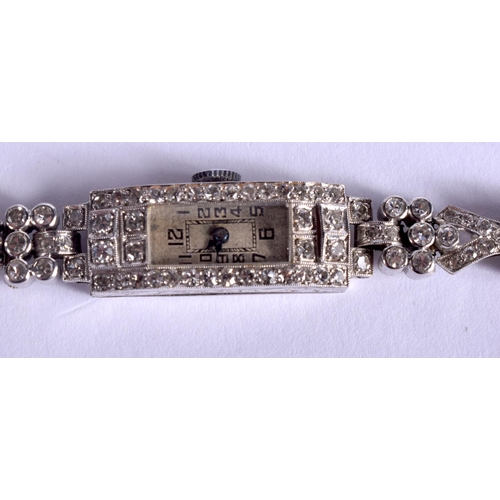 1796 - AN ART DECO PLATINUM AND DIAMOND COCKTAIL WATCH of stylish form. 19.5 grams. 17 cm x 1.2 cm.