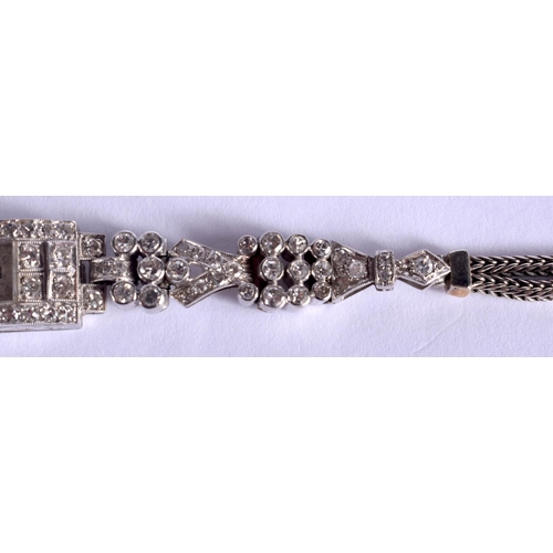 1796 - AN ART DECO PLATINUM AND DIAMOND COCKTAIL WATCH of stylish form. 19.5 grams. 17 cm x 1.2 cm.