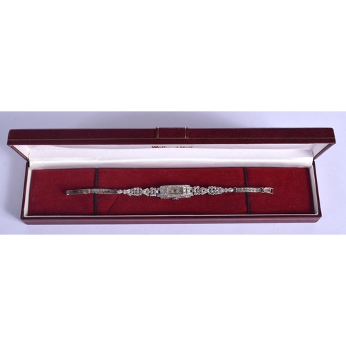 1796 - AN ART DECO PLATINUM AND DIAMOND COCKTAIL WATCH of stylish form. 19.5 grams. 17 cm x 1.2 cm.