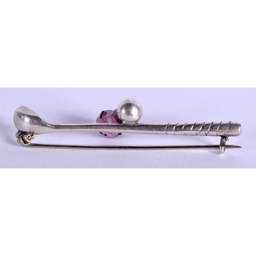 1802 - A RARE ANTIQUE SILVER AND AMETHYST GOLF CLUB BROOCH. 5.5 cm wide.