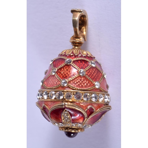 1857 - A CONTINENTAL SILVER AND ENAMEL EGG PENDANT. 11 grams. 3 cm x 1.5 cm.