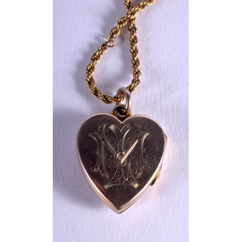 1862 - AN EDWARDIAN 9CT GOLD HEART PENDANT on chain. 7.5 grams.