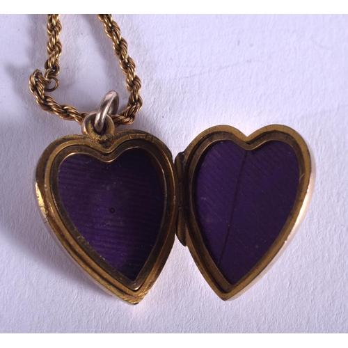 1862 - AN EDWARDIAN 9CT GOLD HEART PENDANT on chain. 7.5 grams.