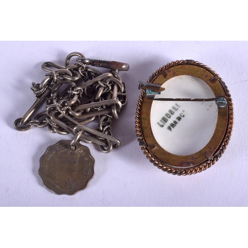 1879 - A SILVER BRACELET and brooch. (2)