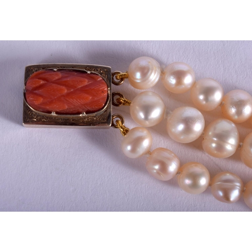 1899 - AN EDWARDIAN GOLD CORAL AND PEARL BRACELET. 45 grams. 18 cm long.