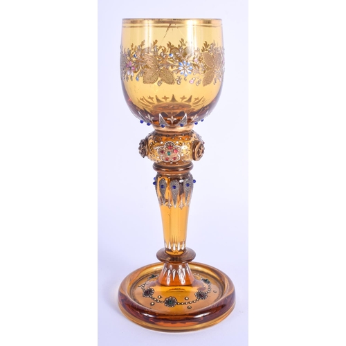 19 - A LOVELY ANTIQUE CONTINENTAL AMBER GLASS probably German, overlaid in enamel and jewelled. 17 cm hig... 