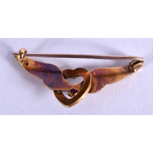 1907 - AN ANTIQUE GOLD RUBY AND PEARL SWEETHEART BROOCH. 3.4 grams. 4.25 cm wide.