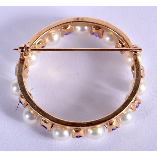 1927 - AN EDWARDIAN GOLD PEARL AND AMETHYST BROOCH. 10 grams. 4.25 cm wide.