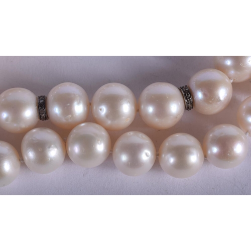 1937 - A PEARL AND DIAMOND NECKLACE. 68 grams. 42 cm long.