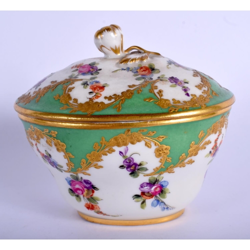 194 - 19th c. Paris porcelain oval box and cover painted with flowers in a shape raised gilt panel on an a... 