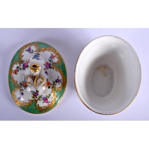 194 - 19th c. Paris porcelain oval box and cover painted with flowers in a shape raised gilt panel on an a... 