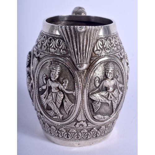 1943 - AN ANTIQUE INDIAN SILVER CREAM JUG. 138 grams. 9 cm high.