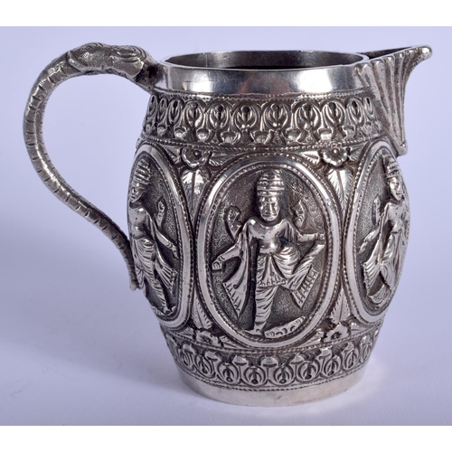 1943 - AN ANTIQUE INDIAN SILVER CREAM JUG. 138 grams. 9 cm high.