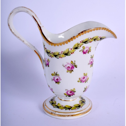 195 - 19th c. Paris porcelain footed milk jug painted with roses under a leaf and berry chain and dentil g... 