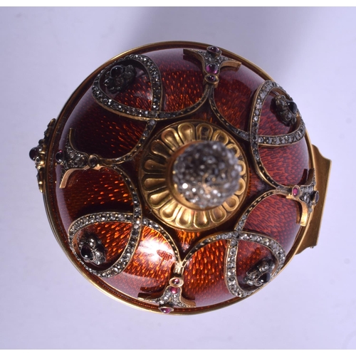 1951 - AN UNUSUAL CONTINENTAL SILVER GILT ENAMEL RUBY AND JADE EGG overlaid with foliage and vines. 566 gra... 