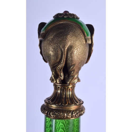 1952 - A BOXED CONTINENTAL SILVER GILT AND ENAMEL NEPHRITE JADE ELEPHANT PAPER KNIFE. 156 grams. 23 cm long... 