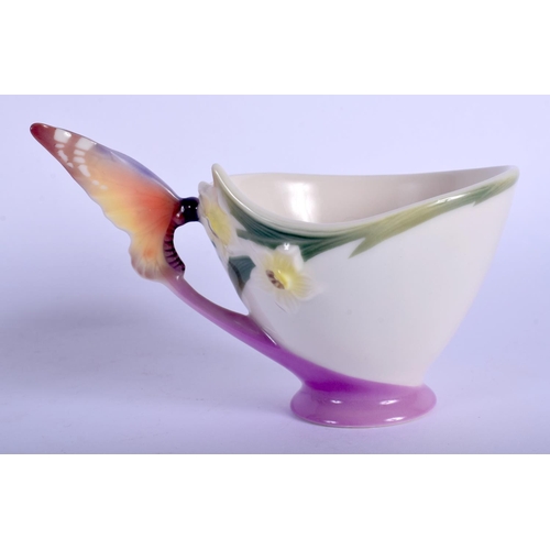 199 - 20th c. Franz teacup and saucer with butterfly wing handle , marked xp1693 FRANZ and signature.