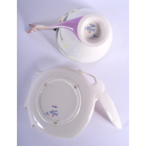 199 - 20th c. Franz teacup and saucer with butterfly wing handle , marked xp1693 FRANZ and signature.