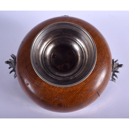 2001 - AN EDWARDIAN SILVER PLATED OAK MONTEITH TYPE BOWL with plain shield and deer head mounts. 31 cm x 22... 