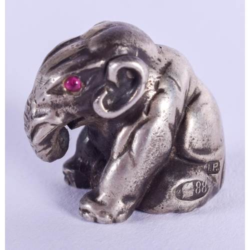 2015 - A CONTINENTAL SILVER FIGURE OF AN ELEPHANT with ruby eyes. 19 grams. 1 cm x 1 cm.