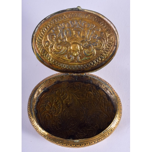 2024 - AN 18TH/19TH CENTURY INDIAN BRASS BUDDHISTIC SNUFF BOX. 7 cm x 5.25 cm.