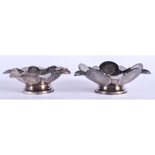 2041 - A PAIR OF CONTINENTAL SILVER COIN DISHES. 354 grams. 11 cm wide.