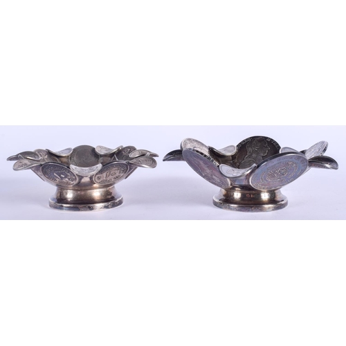 2041 - A PAIR OF CONTINENTAL SILVER COIN DISHES. 354 grams. 11 cm wide.