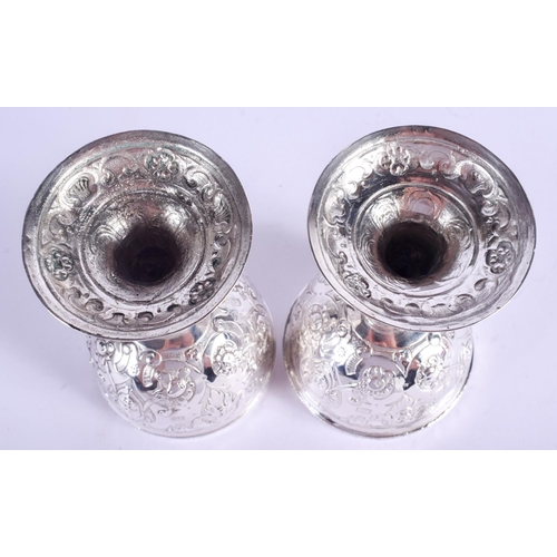 2047 - AN ANTIQUE CONTINENTAL SILVER DOUBLED ENDED STACKING CUPS possibly for wagering, decorated with putt... 