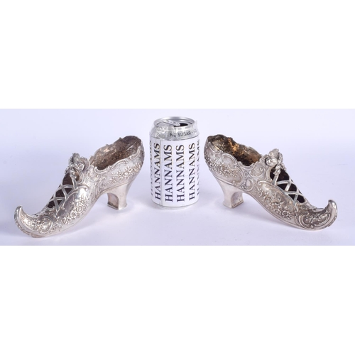 2055 - A RARE LARGE PAIR OF 19TH CENTURY CONTINENTAL SILVER SHOES decorated with flowers and scrolling moti... 