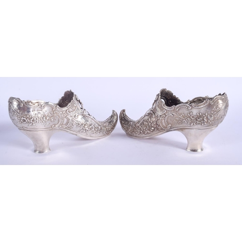 2055 - A RARE LARGE PAIR OF 19TH CENTURY CONTINENTAL SILVER SHOES decorated with flowers and scrolling moti... 