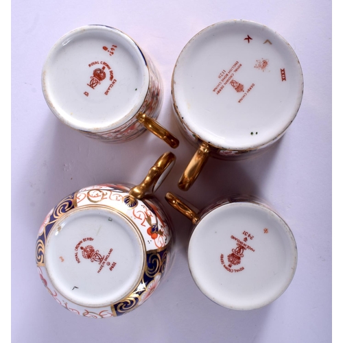 208 - Royal Crown Derby imari patterns: a pair of coffee cans and saucers pattern 2451, a similar coffee c... 