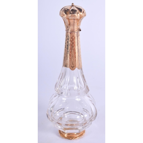 2081 - AN ANTIQUE 18CT GOLD MOUNTED GLASS SCENT BOTTLE. 9.5 cm high.